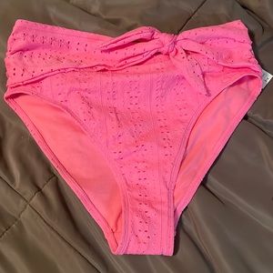 Celebrity pink, swim bottoms, side tie eyelet design. Size women’s large 11-13.